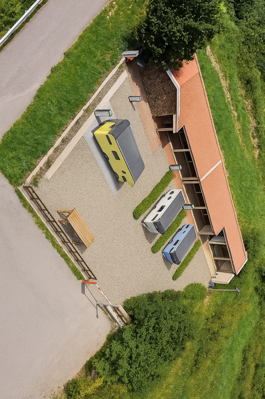 Osilo Camper Area - Aerial view of our smart camping facility with positioned campers and modern amenities